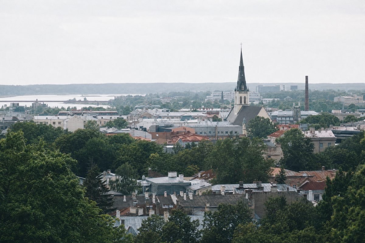 An elevated view over the rooftops and streets of a mid-size town